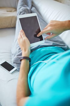 Young man using modern gadgets at leisure
