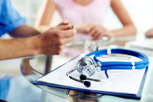 Prescription paper and stethoscope on workplace of doctor