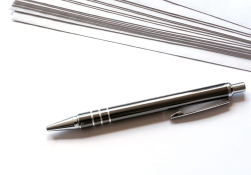 Stationery and ballpoint pens on a desk