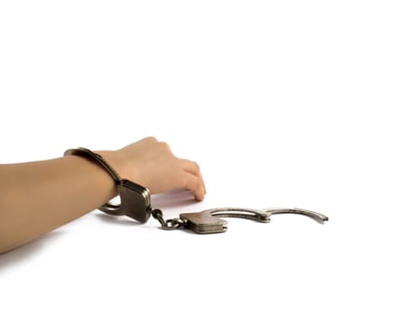 elegant female hand stiffness in handcuffs