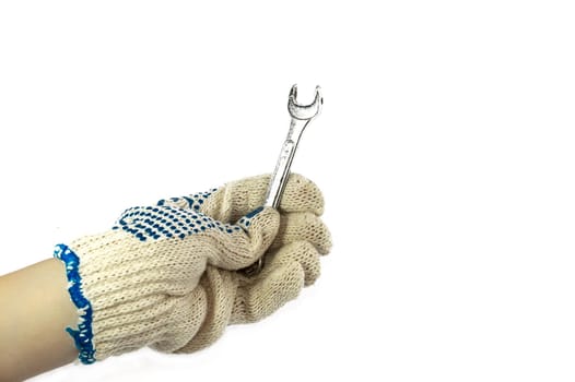 Working hand in glove holding a tool