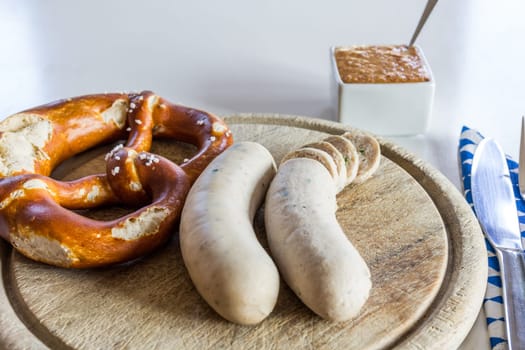 A snack - white sausage and pretzel