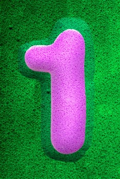 The number one in a pink sponge like texture, raised 3D from the green background.