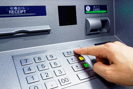 ATM - entering pin close up