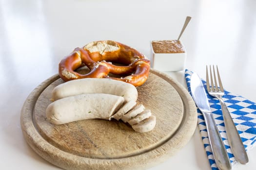 A snack - white sausage and pretzel