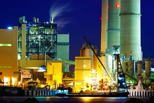 power station at night with smoke , hong kong