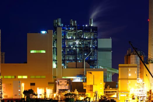 power station at night with smoke , hong kong
