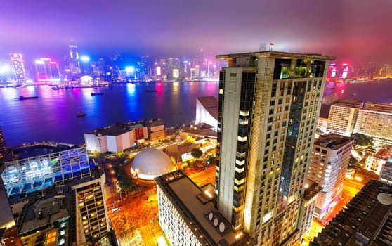 Hong Kong night view of skyline with reflections at victoria harbor