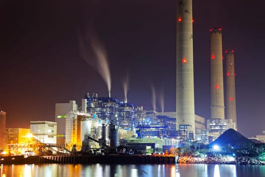 power station at night with smoke, hong kong