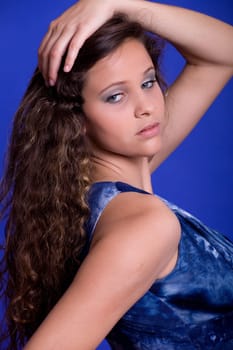 young beautiful woman, on a blue background