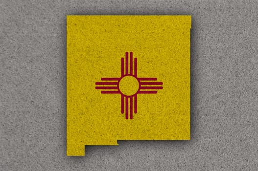 Map and flag of New Mexico on felt
