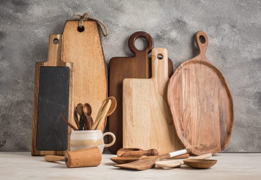 Collection of wooden kitchen utensils, kitchenware, cutting boards and spoons