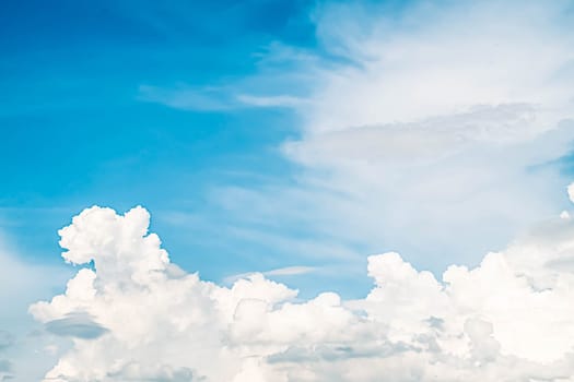 Beautiful white fluffy clouds sky background with blue sky background for copy space