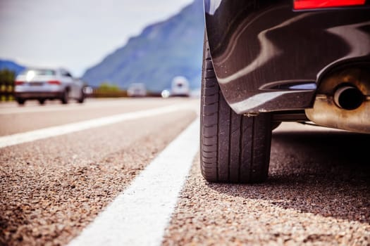 Close up of a car standing on a breakdown lane, summer vacation