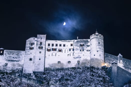 Fortress of Salzburg and the moon: Winterly in the night.
