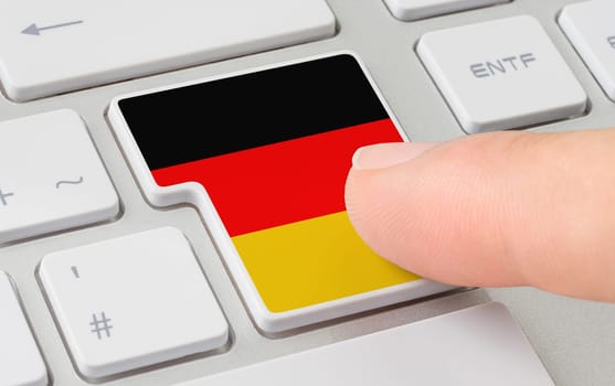 A keyboard with a labeled button - Flag of Germany