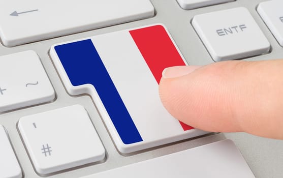 A keyboard with a labeled button - Flag of France