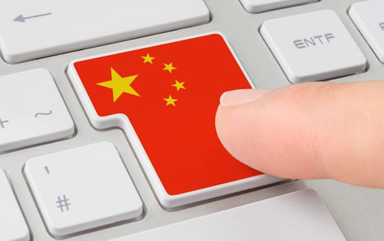 A keyboard with a labeled button - Flag of China