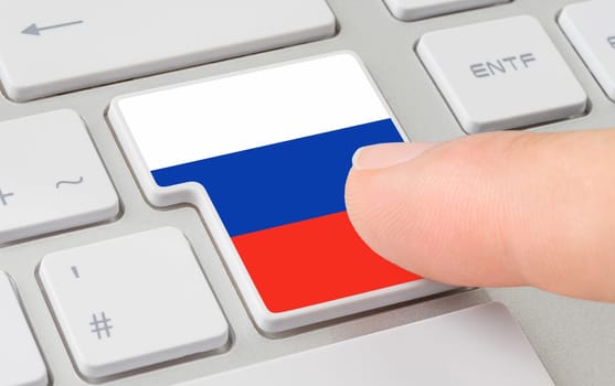 A keyboard with a labeled button - Flag of Russia