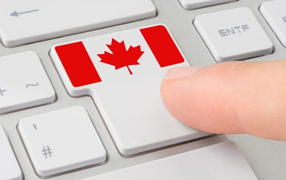 A keyboard with a labeled button - Flag of Canada
