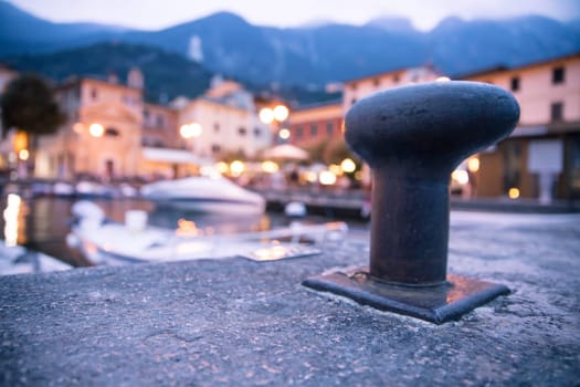 Italian harbour in the evening, small cute village and lighrs in the blurry background