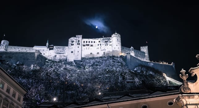 Fortress of Salzburg and the moon: Winterly in the night.