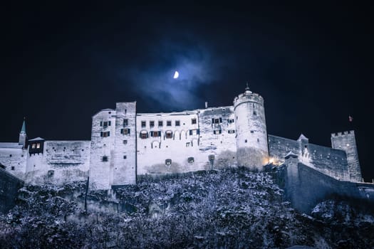Fortress of Salzburg and the moon: Winterly in the night.