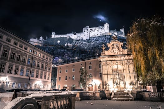 Fortress of Salzburg and the moon: Winterly in the night.