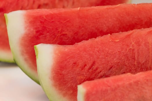 Sliced water melon fruit pieces from market for healthy nutrition at breakfast, dessert or snack. Sweet fresh holiday summer food.