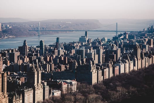 Panoramic elevated view of Central Park, Upper West Side and the George Washington Bridge with Hudson River in Fall. Manhattan, New York City, USA