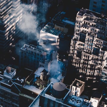 New York City, USA. Midtown Manhattan building rooftops with steam comming from the heating systems.