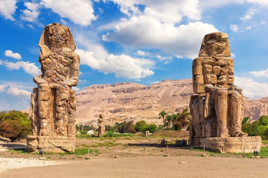 The Colossi of Memnon in the Theban Necropolis, statues of the Pharaoh Amenhotep, Luxor, Egypt.