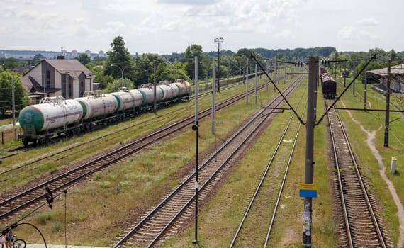 Railway stations with carriages and railroad tracks and trains, transport system. The way forward is the railroad. The modern railway infrastructure was reconstructed. Ukraine, Kiev - August 19, 2021