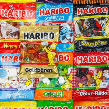 Stuttgart, Germany - March 7, 2021: Haribo gummy bear gummi candy candies different types variety background square in Stuttgart, Germany.