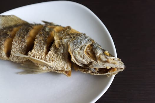 deep fried snapper fish in white dish