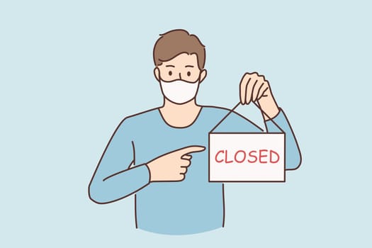 Business crisis during pandemic concept. Young sad man in protective medical mask standing showing sign with closed word during covid epidemic concept vector illustration