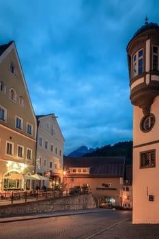 Fussen, Germany, September 27, 2015: Evening street scene with an outdoor cafe in Fussen, Germany