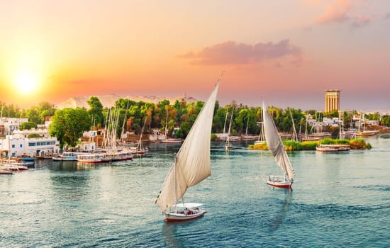 Sunset in Aswan, scenery of the Nile and boats, Egypt.