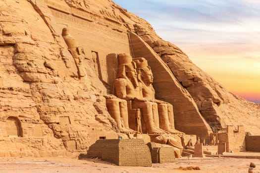 Abu Simbel, Egypt, view of the Great Temple's colossal statues, sunset light.
