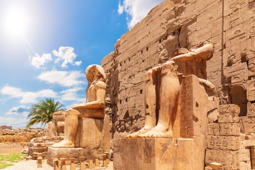 Karnak Temple Pylon Facade and statues, Luxor, Egypt.