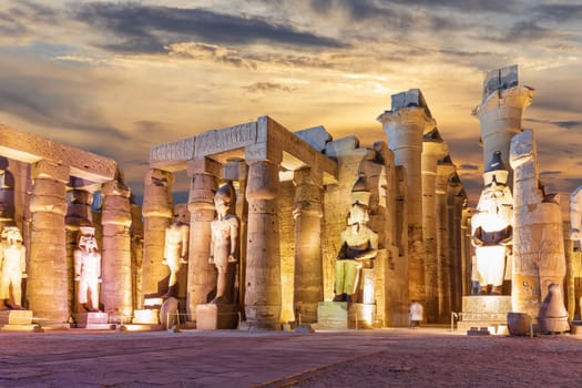 Columns and statues of the Luxor Temple, Egypt, evening view.