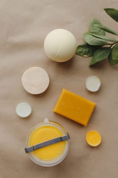 Flat lay of spa natural ingredient soap treatment set, top view on craft paper