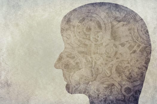 Silhouette human face with gearwheel on a textured background, empty copy space for text