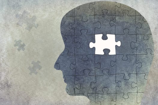 Silhouette of a head on a textured background, puzzle with missing part, thinking, mind, reminder