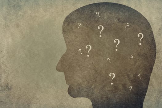 Silhouette of a head with question marks, empty copy space
