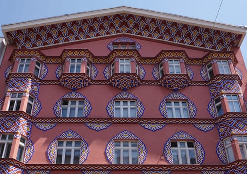 Artisty red facade on a house in Ljubljana, Slovenia, 2020