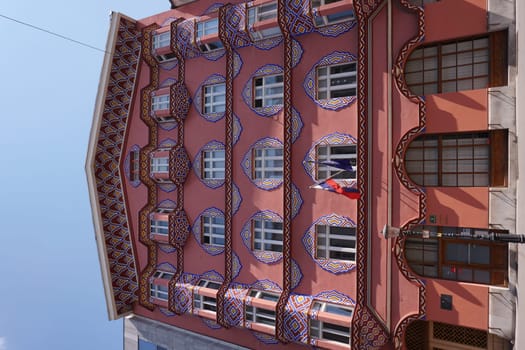 Artisty red facade on a house in Ljubljana, Slovenia, 2020