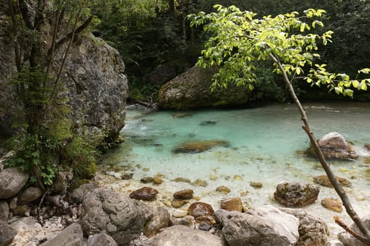 Small naturall pool in the Soca River Stream, Slovenia 2020