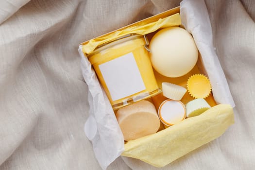 Natural cosmetics set in gift box. Body cream, essential oils, handmade soap. Top view