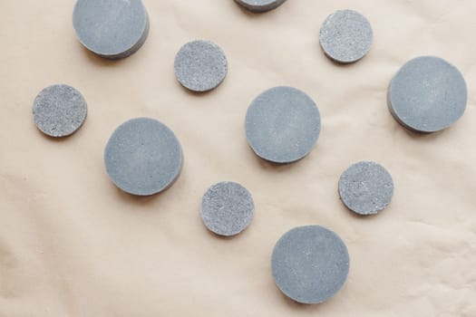 Eco friendly natural solid shampoo and hair conditioner on paper background. Concept animal fat free, zero waste cosmetics